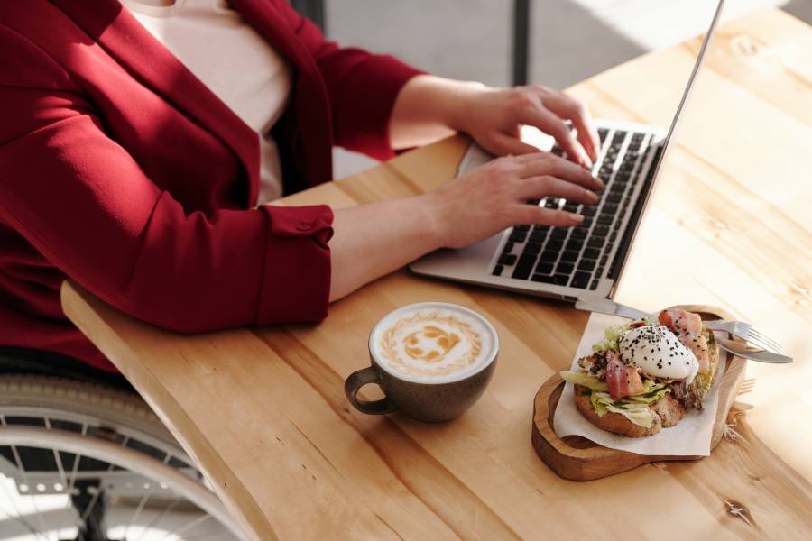 woman using computer at restaurant